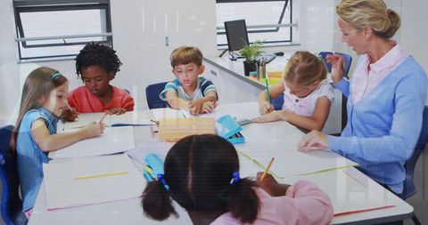 Teacher Guiding Students in a Blended Learning Environment - Download Free Stock Images Pikwizard.com