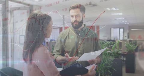 Colleagues Analyzing Data and Discussing in Modern Office