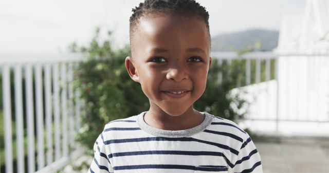 Smiling Young Boy with Braids Outdoor on Relaxing Afternoon - Download Free Stock Images Pikwizard.com