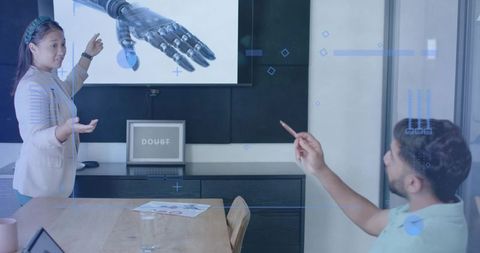 Businesswoman Presenting Robotic Arm Innovation in Futuristic Meeting