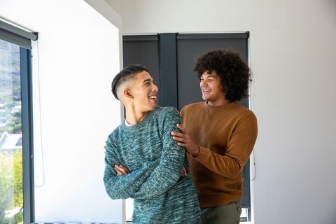 Two Friends Enjoying Moment in Modern Interior
