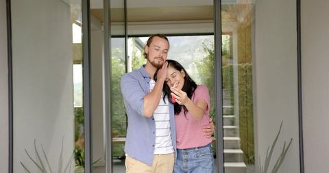 Happy Couple Embracing New Home Ownership