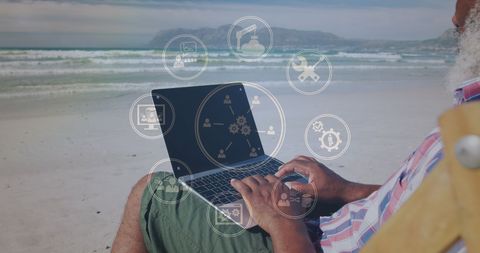 Senior Man Working Remotely on Beach with Technology Icons