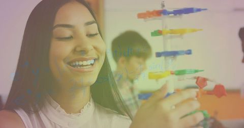 Smiling Student Exploring Math with Molecular Model - Download Free Stock Images Pikwizard.com