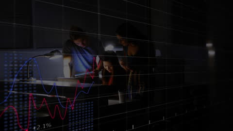 Business Team Analyzing Financial Data in Office at Night