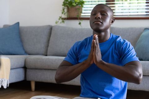Man Practicing Mindfulness at Home with Peaceful Focus