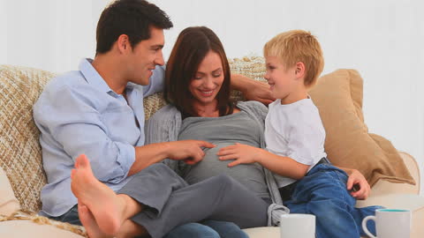 Happy Family Expecting New Arrival at Home