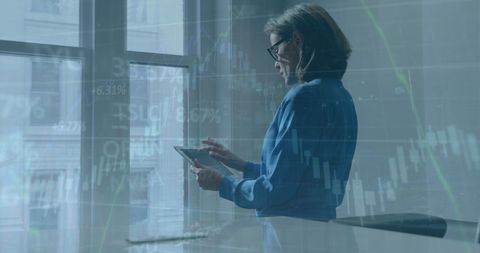 Businesswoman Analyzing Tablet with Financial Data Overlay