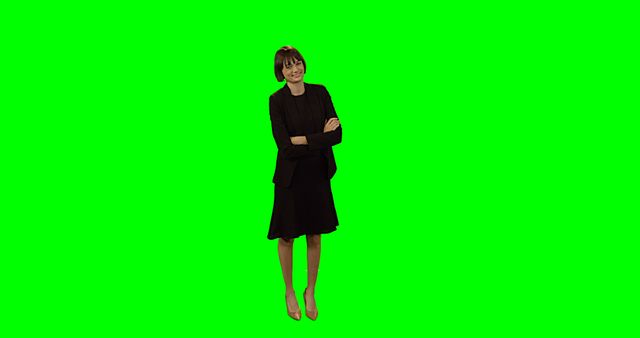 Depicting a businesswoman with short hair standing confidently while smiling against a green screen background, this image can be used for diverse corporate presentations, promotional materials, stock photography, marketing brochures, or advertisements needing a professional and approachable representation of business professionals.