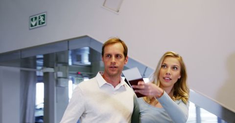 Happy couple engaging at airport terminal