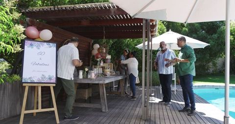 Senior Friends Celebrating 60th Birthday Poolside Gathering