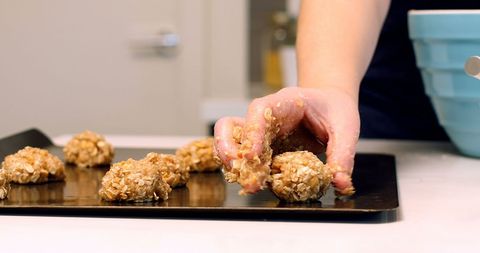 Woman Preparing Homemade Cookies with Oatmeal Dough