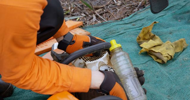 Worker Maintaining Chainsaw Outdoors - Download Free Stock Images Pikwizard.com