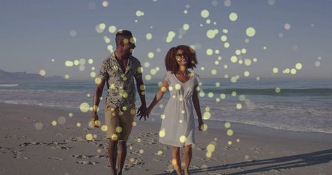 Romantic Couple Walking on Sunny Beach with Sunglasses