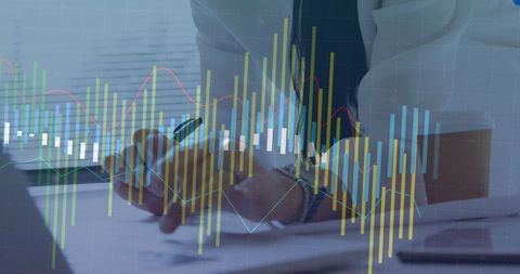 Businesswoman analyzing statistical data overlay in office