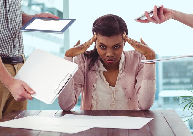 Businesswoman in office appears stressed and frustrated, hands to her temples, surrounded by hands presenting clipboard, documents, tablet, and smartphone. Ideal for illustrating corporate stress, busy work environments, challenges of multitasking, and employee burnout. Suitable for articles, presentations, and advertisements relating to workplace stress and productivity.