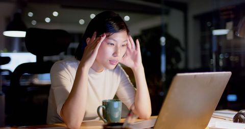 Asian Businesswoman Working Late with Laptop in Office - Download Free Stock Images Pikwizard.com