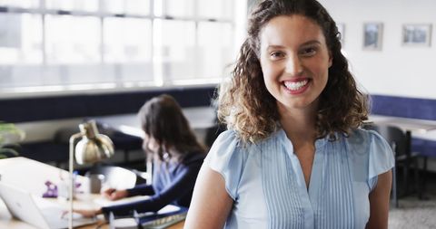 Smiling Businesswoman in Modern Office Space
