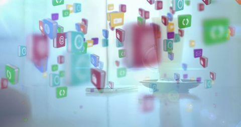 Flying social media icons over smartphone on table