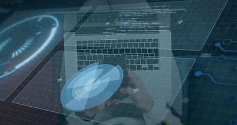 Developer typing holding holographic radar interface over laptop keyboard with code and hud