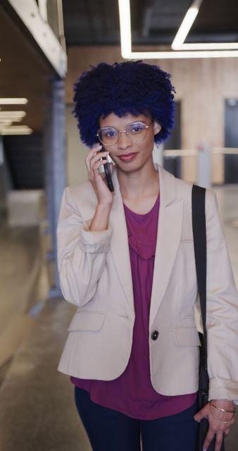 Modern Professional with Purple Hair Talking on Phone in Office - Download Free Stock Images Pikwizard.com