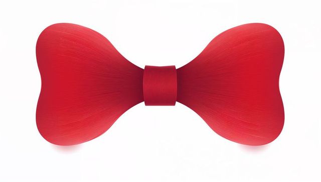 Minimalist crimson bow with textured ribbon, symmetrical central knot on white studio backdrop