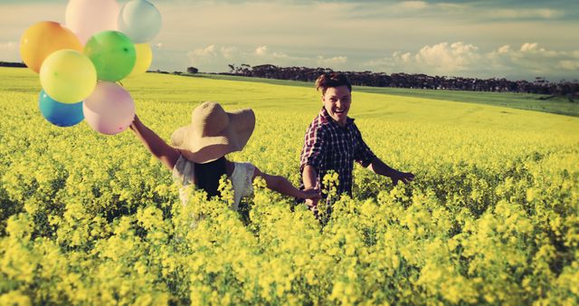 Happy Couple Enjoying Summer Field With Colorful Balloons - Download Free Stock Images Pikwizard.com