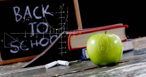 Back to school concept with mathematical equations and apple