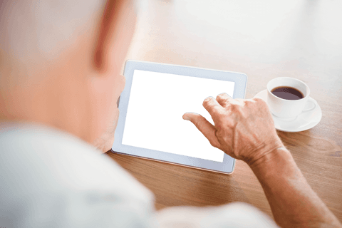 elderly man using tablet with coffee on transparent background - Download Free Stock Videos Pikwizard.com