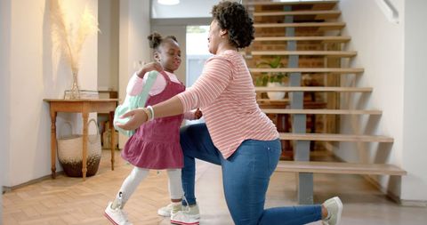 Mother Hugging Daughter on First Day of School - Download Free Stock Images Pikwizard.com