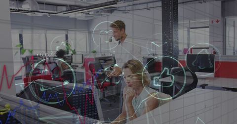 Innovative Team Analyzing Financial Data with Digital Interface in Modern Office