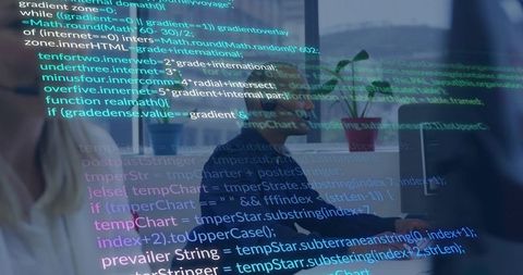 Developers collaborating over code reflected on glass in modern minimalist office nook