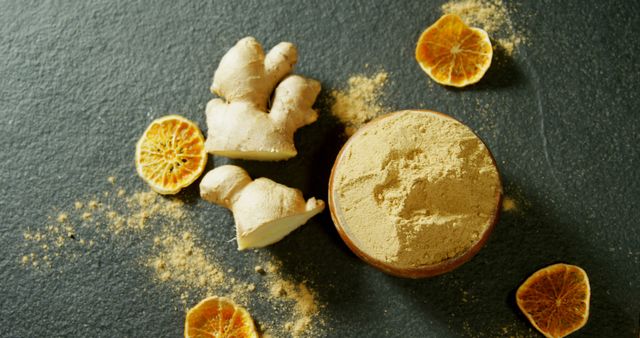 Ginger Root and Powder with Dried Orange Slices on Slate Surface - Download Free Stock Images Pikwizard.com