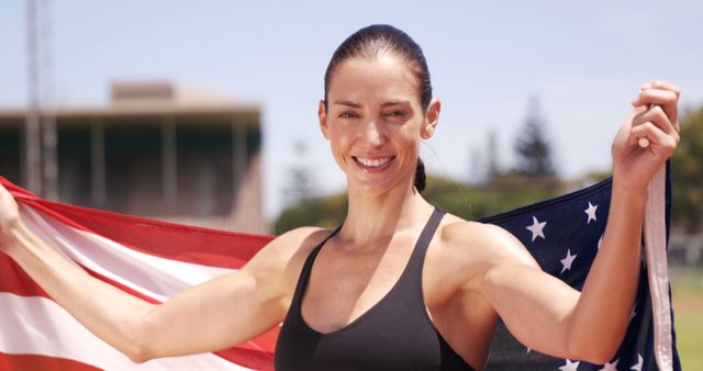 Fit woman celebrating with USA flag outdoors - Download Free Stock Images Pikwizard.com