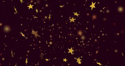 Shimmering gold stars on dark burgundy background