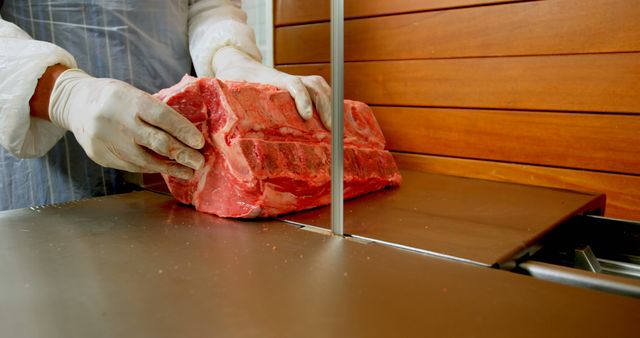 Butcher Slicing Large Beef Cut in Modern Butcher Shop - Download Free Stock Images Pikwizard.com