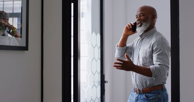 Senior Man Talking on Smartphone Indoors - Download Free Stock Images Pikwizard.com