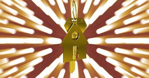 Gold house key hangs amid radiant celebration