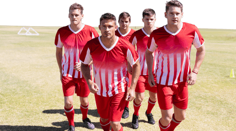 Caucasian male football players exercising in stadium, transparent background