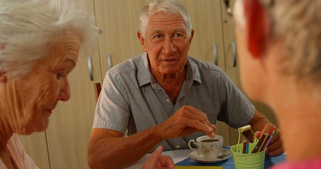 Senior Friends Enjoying Tea Time and Conversing in Cozy Setting - Download Free Stock Images Pikwizard.com