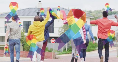 Diverse protesters united for lgbt rights with flags and ribbons