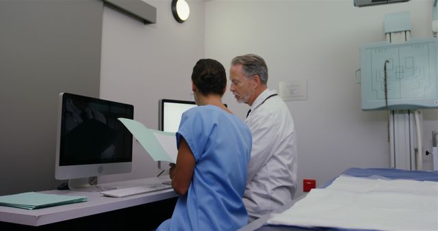 Healthcare Professionals Reviewing X-Ray Records on Computer - Download Free Stock Images Pikwizard.com