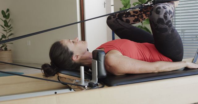 Woman Exercising on Pilates Reformer at Home - Download Free Stock Images Pikwizard.com