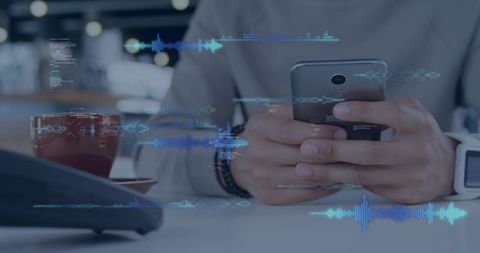 Tapping smartphone at cafe table with digital audio waveforms and smartwatch on wrist