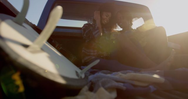 Friends Enjoying Sunset in Pickup Truck Bed - Download Free Stock Images Pikwizard.com