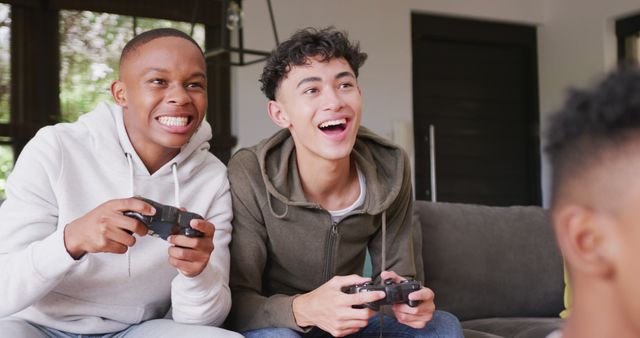 Enthusiastic Teen Friends Playing Video Games Together Indoors - Download Free Stock Images Pikwizard.com