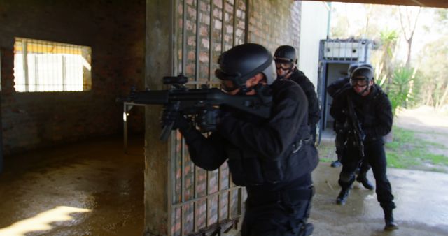 SWAT Team in Tactical Action Outside Building During Raid - Download Free Stock Images Pikwizard.com