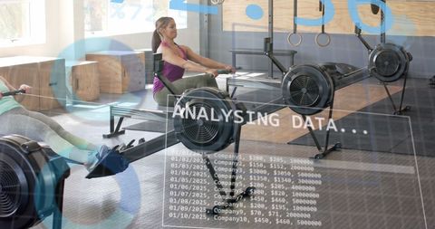 Women training on rowing machines with digital data interface overlay
