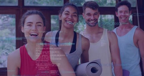 Smiling Group in Fitness Studio Holding Yoga Mats