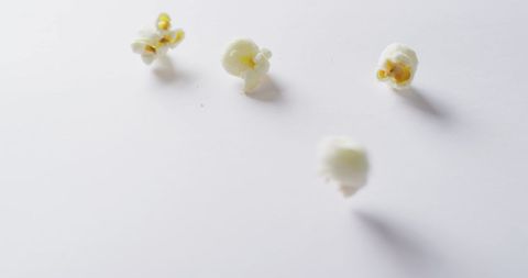 Scattered Popcorn on Minimalistic White Background - Download Free Stock Images Pikwizard.com